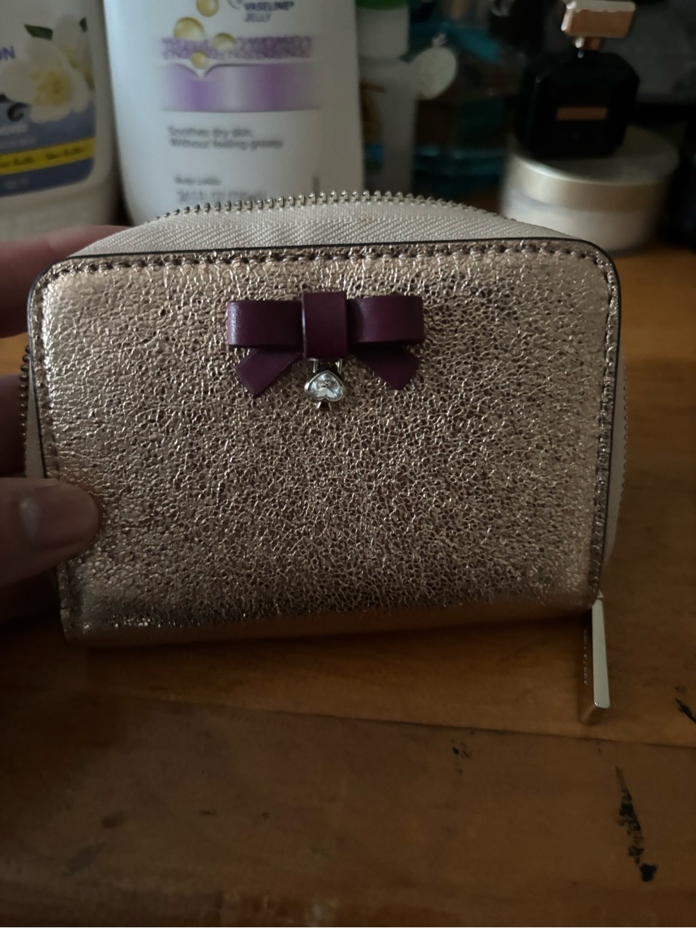 kate spade Rose Gold Metallic Zip Wallet with Purple Bow
